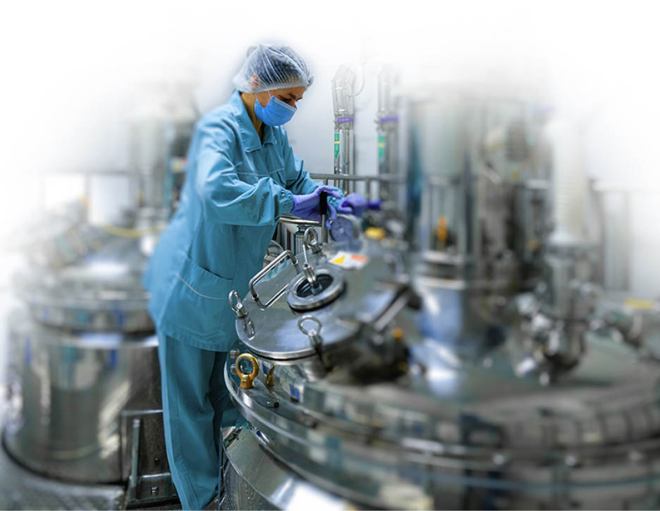 Pharmaceutical technician in sterile environment at pharmacy industry