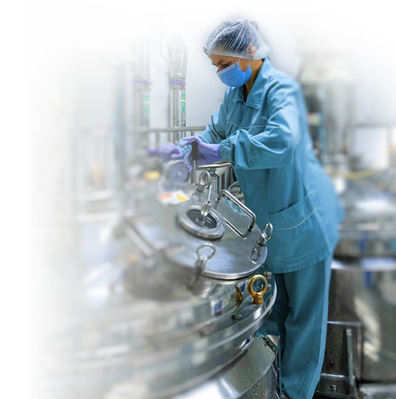 Pharmaceutical technician in sterile environment at pharmacy industry