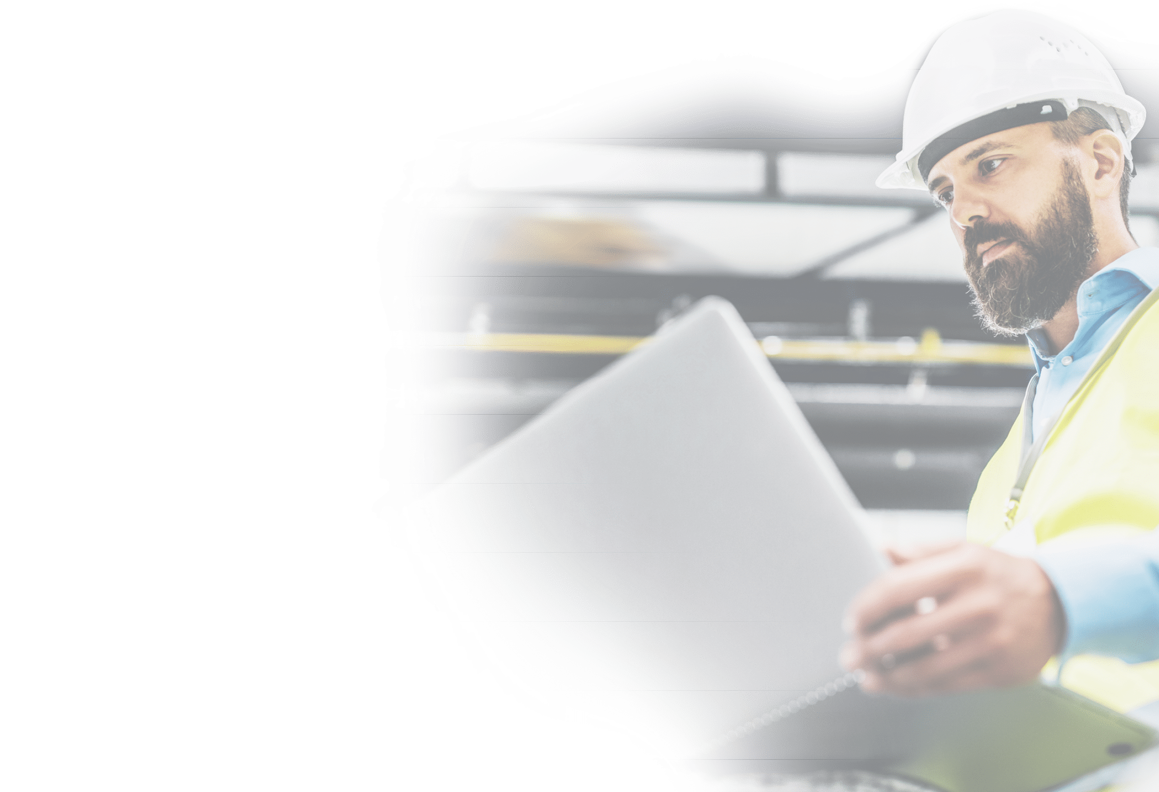 A portrait of a mature industrial man engineer with laptop in a factory, working.