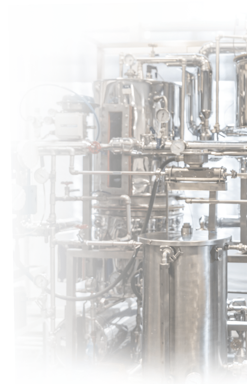 Back view of male student working at the process lab distilling liquids - Education concepts